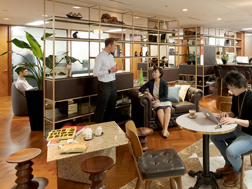 Coworking area at 17 State Street, New York, where clients interact and collaborate in a dynamic, professional environment.