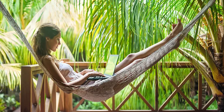 Virtual office at Servcorp, where a woman enjoys her vacation knowing she can work remotely from anywhere.