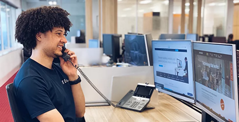 A team member delivers professional support from a Servcorp virtual office setup, equipped for seamless global communication.